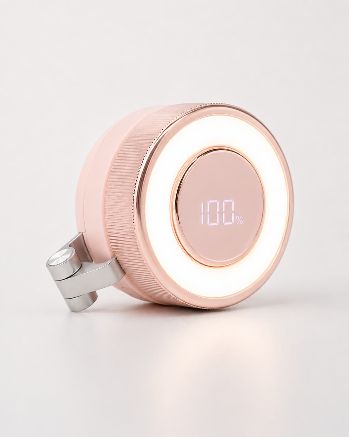 Close-up of the pink BreezeClip portable bladeless fan showing the integrated smart digital display at 100% battery with active warm LED ring light.