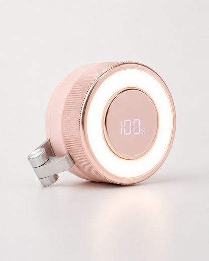 Close-up of the pink BreezeClip portable bladeless fan showing the integrated smart digital display at 100% battery with active warm LED ring light.