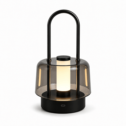 Black portable cordless LED table lamp with metal handle and smoked acrylic shade on white background