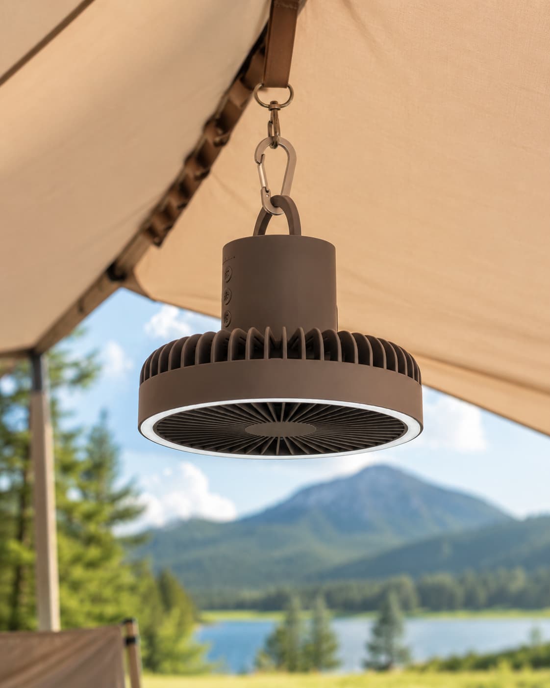 Portable camping fan hanging inside tent canopy