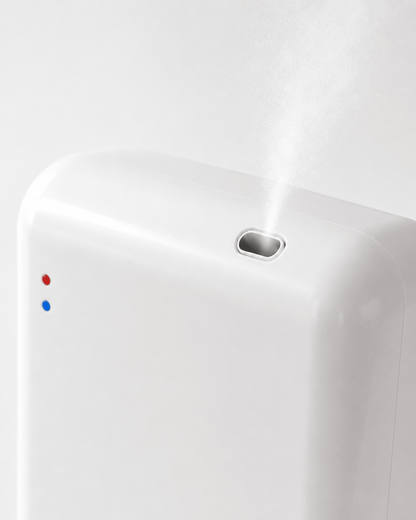 Close-up of the StellTails SL-02 waterless diffuser top atomizing nozzle dispersing a fine scent mist, highlighting precision engineering and indicator lights.
