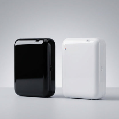 StellTails SL-02 waterless scent diffusers shown side-by-side in black and white finishes, highlighting sleek pebble-inspired design with smooth rounded edges.